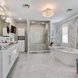 Modern Master Bathroom with chevron patterned marble wall 