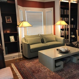 The Study. Retractable TV over fireplace and custom sofa by Kravet. 