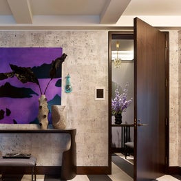 Graphic entrance gallery with custom wallpaper and colorful artwork