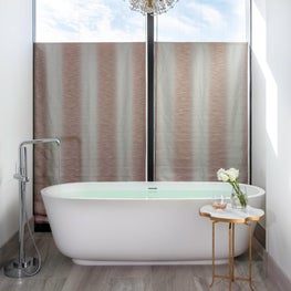 Portfolio: Neutral bathroom with a large, white soaker tub