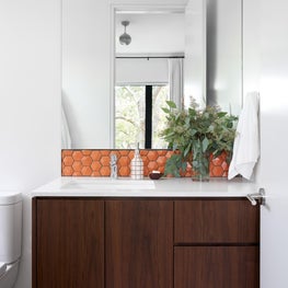 Inspired by the son's love of soccer, his favorite team colors throughout the bedroom and bath.