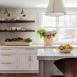 Kitchen with Floating Walnut Shelves and Off-White Cabinetry