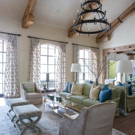 Large comfortable family room- reclaimed beams, custom lighting & pops of color