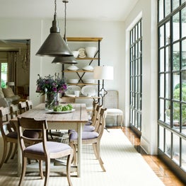 At Home dining room with large windows