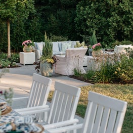 Glenview Patio. Blue and white scheme with floral accents, natural slate pavers & wicker furniture.