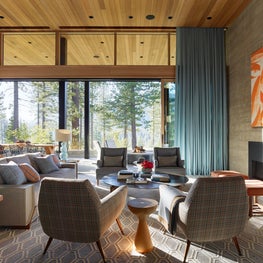 Tahoe Marvel, Great Room with motorized drapery and brass coffee table. 