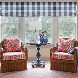 Lake Geneva Guest Bedroom. Red, white & blue scheme with wicker chairs, painted table & buffalo check shades.