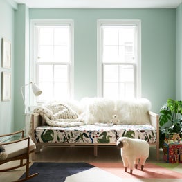 Tropical-Scandinavian nursery and little girl's bedroom on Park Avenue