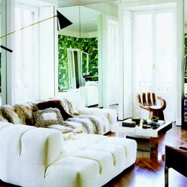 Milan. Living Room with vintage hand chair and custom sofa by Patricia Urquiola.