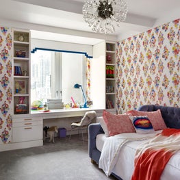 Teenage girl's bedroom with bright pops of color and modern furniture