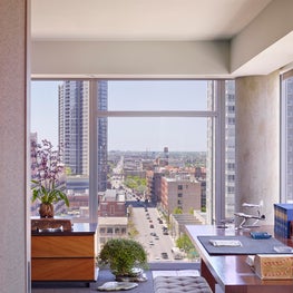 Penthouse Apartment master bedroom with floor to ceiling windows