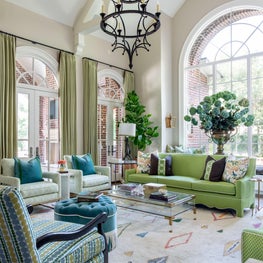 The fresh, airy color palette compliments the natural light in this family room