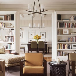 NYC Apartment Living and Dining Room with built-in bookcases 