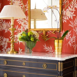 Red printed wallpaper foyer vignette