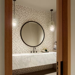 Tahoe Marvel, main powder room with a marble floating vanity.