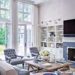 Family Room, Indoor-Outdoor Living, Neutral Palette, Cream Walls, White Cabinets, Blue Fireplace, Coffee Table, Lee Industries Chairs, Rogers and Goffigon Linen, Urban Electric Sconces - Ravinia Residence Project