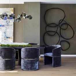 Formal Dining Room anchored by art and smoked glass chandelier by Gabriel Scott.