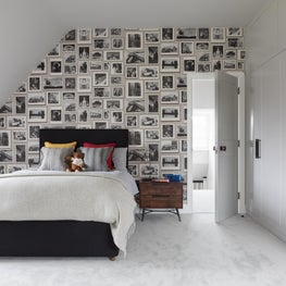Teenage boys bedroom with photo wallpaper and bespoke joinery 