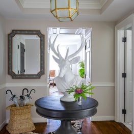 Beacon Hill Pied-A-Terre Foyer with Zebra Rug and Deer Statue