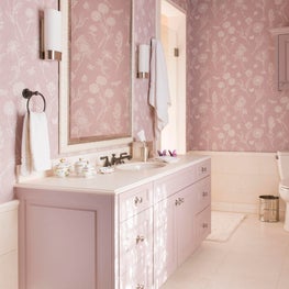 Girls bath with purple accents and wallpaper on walls and ceiling 