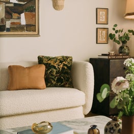 Vignette with Vintage Oil Painting, Marble Table & Ivory Sofa