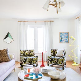 Eclectic Living Room with Floral Chairs and Yellow Floor Lamp