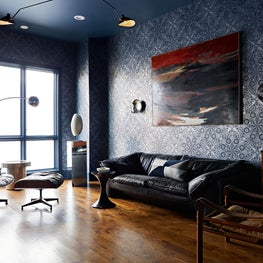 Rock n’ Roll lounge designed for this entertainer complete with vintage furnishings, modern art, and custom mylar musical mandala wallpaper.