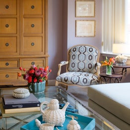 Washington D.C. Great Room. Neoclassic armoire with French chair in modern geometric upholstery & modern tea set.