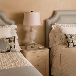 Soft blue's and neutral color palette make a peaceful guest bedroom