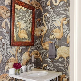 Powder room with bird print wallpaper