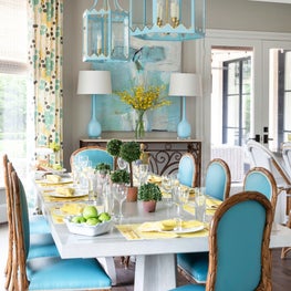 Transitional breakfast room with an icy blue palette, custom chairs & lighting
