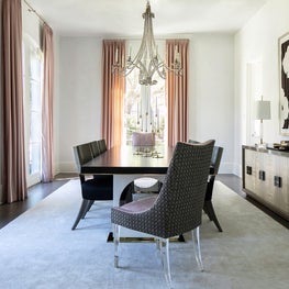 Portfolio: A romantic dining room with black and white console and blush drapery.