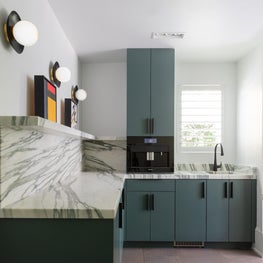 Pantry Shot with Custom cabinets, bespoke stone details, LED Sconces, and Mid-Century mini paintings