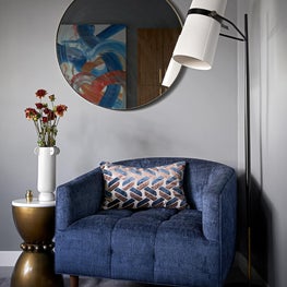 Darker blues and grays, make for the perfect work environment for the homeowner as he works from home.