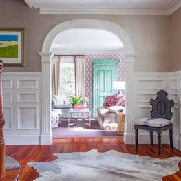 Entryway Foyer and Living Room with Animal Hide and Detailed Millwork