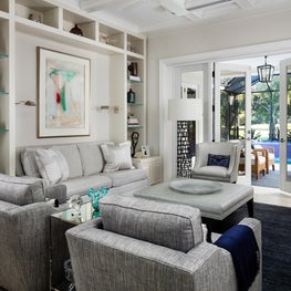 Bespoke built-in niches display the homeowner’s collection of ceramics.