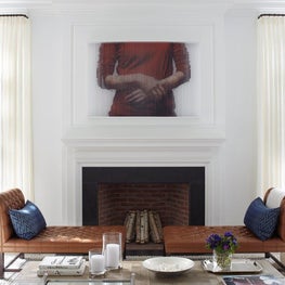 An elegant georgian inspired fireplace and new windows to brigten this room