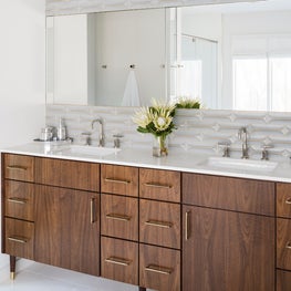 Portfolio: Double Vanity Features Dark Stained Cabinetry