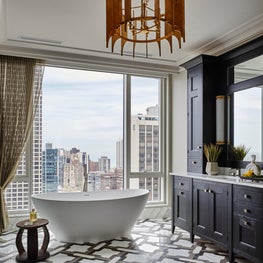 Standout Master Bathroom with custom marble floor tiles