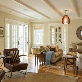 Zebra print, leather chairs, ikat rug, modern pendant