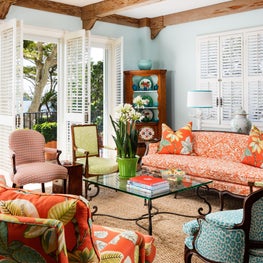 White bahamian window shutters allow for ocean views.