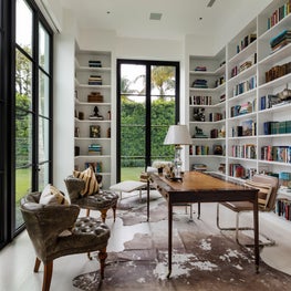 Light and airy modern office with garden views through steel doors