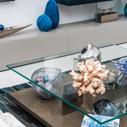 LAKEFRONT CONTEMPORARY VILLA, modern shelving, glass top two tier coffee table, modern living room, neutral den, blue art glass