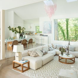 East Hampton Residence - living room with white leather sofa & pink chandelier