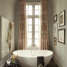 Atlanta Master Bath with vaulted ceiling and freestanding stone tub and original art
