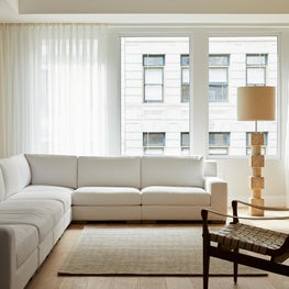 Union Square Penthouse, Lofty Living Room with exposed Brick