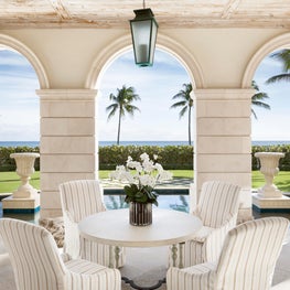 An oceanfront loggia in a Palm Beach Palladian Villa
