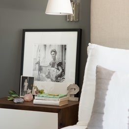 Bedside Table and Sconce Vignette. Eccentric Accessories. Neutral Color Palette.