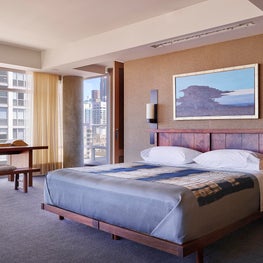 Master bedroom featuring a Japanese walnut bed & grass cloth wall covering