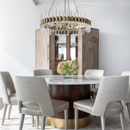 Portfolio: Neutral and Sophisticated dining room with a custom table and gold chandelier